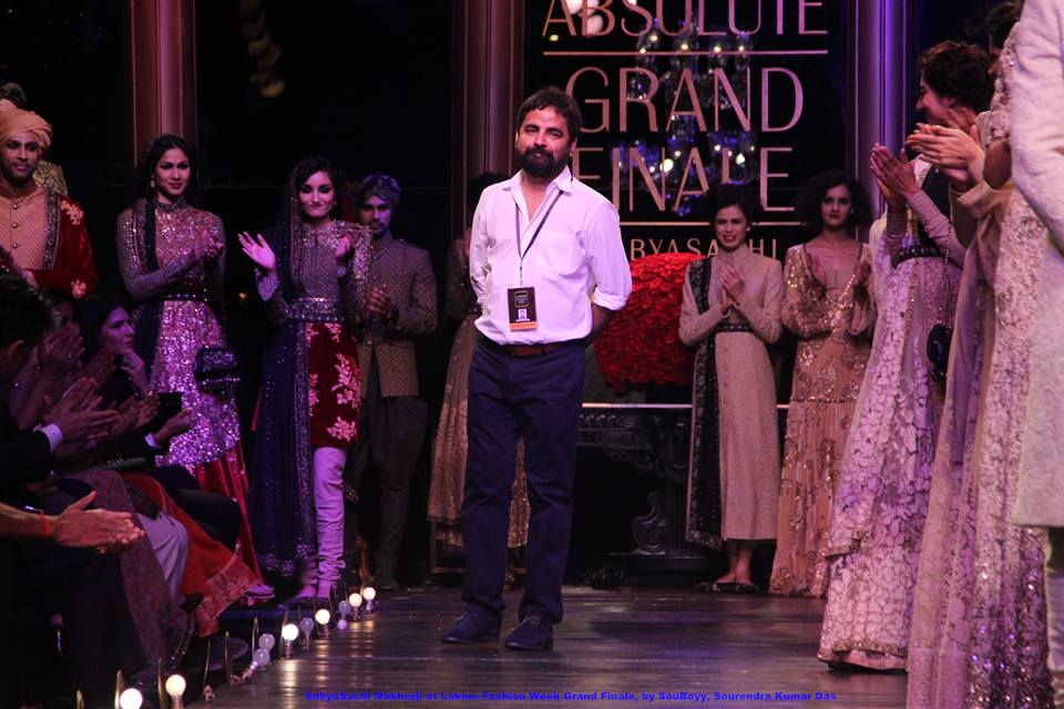 Designer Sabyasachi Mukherjee taking his bow at the Lakmé Fashion Week Grand Finale, surrounded by models