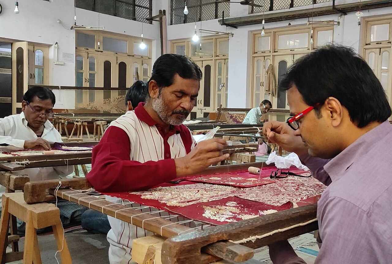 Artisans working on zardozi hand embroidery at a workshop in Farrukhabad, India